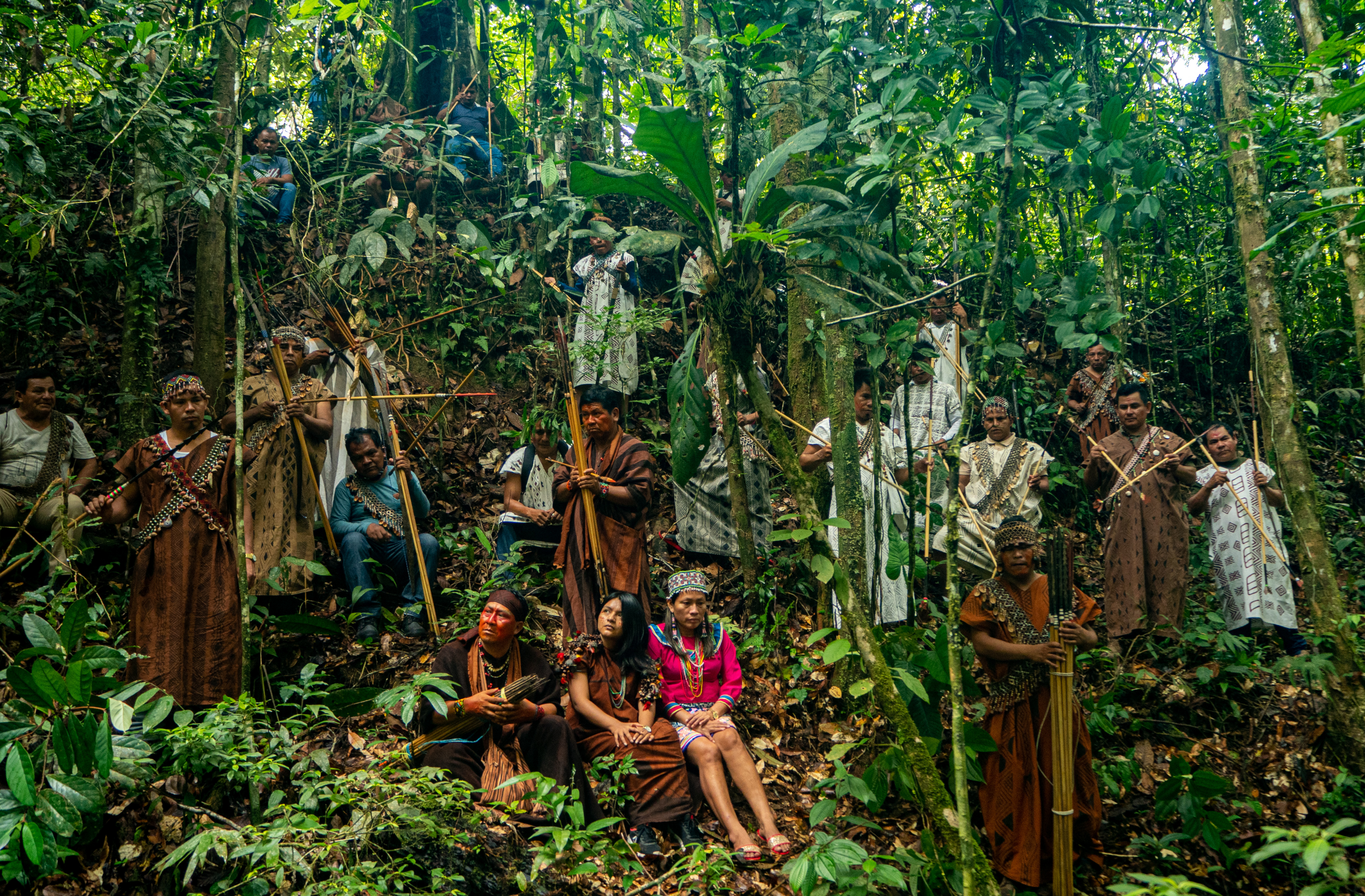 Amazon indiginous group standing in forest